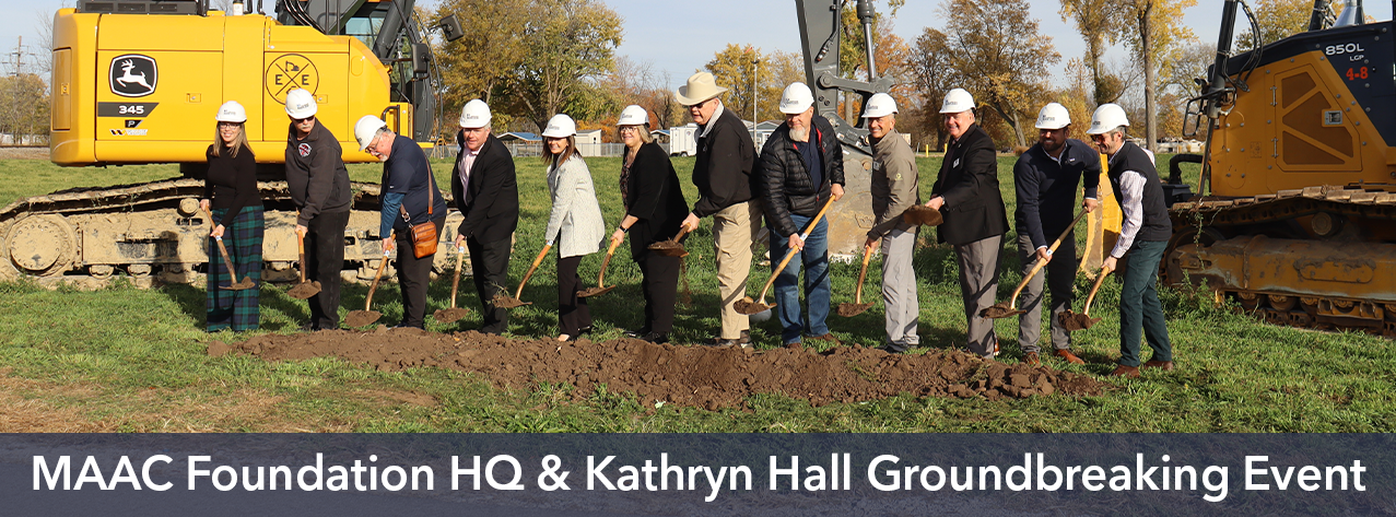 A group uses ceremonial shovels to official break ground on the newest MAAC Foundation addition